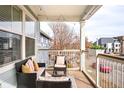 Inviting balcony with outdoor furniture and neighborhood views at 2773 Roslyn St, Denver, CO 80238