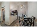 A cozy dining area adjoining an open kitchen with stainless steel appliances and a ceiling fan at 18902 E 17Th Ave, Aurora, CO 80011
