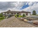 Spacious brick home with a three-car garage and landscaped front yard at 2981 Rock Cir, Elizabeth, CO 80107