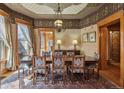 Formal dining room with a large wooden table, ornate chandelier, and stylish decor at 1345 N Franklin St, Denver, CO 80218