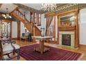 Elegant foyer boasting a grand staircase, ornate fireplace, and intricate ceiling details at 1345 N Franklin St, Denver, CO 80218