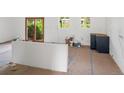 Bright, modern kitchen undergoing renovation with new cabinets and sliding glass doors to the outdoors at 7313 S Boulder Rd, Boulder, CO 80303