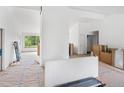 Spacious living room featuring large windows, fireplace, and abundant natural light, ready for finishing at 7313 S Boulder Rd, Boulder, CO 80303