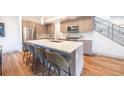 Spacious kitchen features a large island with seating, modern appliances, and stylish cabinetry for a contemporary feel at 822 Fairfax St, Denver, CO 80220