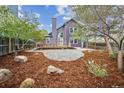 Serene backyard featuring a spacious deck area, gravel area, and landscaped yard at 10729 Kipling Way, Broomfield, CO 80021