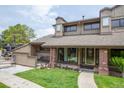 Charming home with a well-manicured lawn, inviting porch, and traditional architectural details at 10652 W Florida Ave # D, Lakewood, CO 80232