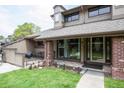 Charming home with a well-manicured lawn, inviting porch, and traditional architectural details at 10652 W Florida Ave # D, Lakewood, CO 80232