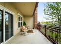 Private balcony features outdoor seating, iron railing and views of the city at 2240 N Clay St # 309, Denver, CO 80211