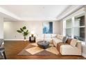 Bright living room featuring hardwood floors, large windows and a comfortable couch at 2240 N Clay St # 309, Denver, CO 80211
