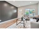 Relaxing living room with wood-look floors and lots of natural light at 175 S Emerson St, Denver, CO 80209