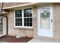 Close-up of the front entrance showcasing a white door and window at 13043 W 20Th Ave, Golden, CO 80401