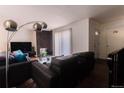Comfortable living room flows nicely to dining area at 1359 S Chambers Cir # C, Aurora, CO 80012