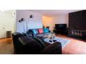 Comfortable living room features hardwood floors and stone fireplace at 1359 S Chambers Cir # C, Aurora, CO 80012
