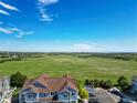 Beautiful aerial view of the neighborhood, showing a large green field and a clear blue sky at 2550 S Cutters Cir # 105, Castle Rock, CO 80108