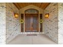 Stunning front door featuring sidelights and accent lighting at 14154 Lexington Cir, Westminster, CO 80023