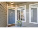 Inviting entryway with a gray door and a glimpse of the kitchen at 4460 S Jebel Ln, Centennial, CO 80015