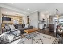 Open living room with view of modern kitchen, dining area, and stylish furniture at 1626 Albion St, Denver, CO 80220