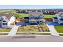Wide aerial perspective of a stylish home showcasing its large yard and community setting at 437 Buckskin Rd, Berthoud, CO 80513