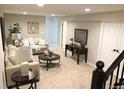 Cozy living room features a comfortable sofa, round wood coffee table, and neutral decor at 6147 Dunraven, Golden, CO 80403