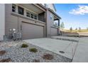 Attached two-car garages offering ample space, with private second story balcony and driveway parking at 16778 W 93Rd Pl, Arvada, CO 80007
