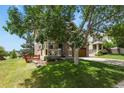 Charming two-story home with a well-manicured lawn and a welcoming porch, perfect for relaxing outdoors at 3912 Miners Candle Pl, Castle Rock, CO 80109