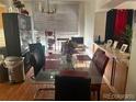 Dining area featuring a glass table and ample seating, ideal for Gathering meals and gatherings at 19939 Mitchell Cir, Denver, CO 80249