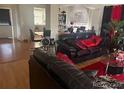 Inviting living room showcasing hardwood floors and modern furnishings, perfect for relaxation and entertaining at 19939 Mitchell Cir, Denver, CO 80249