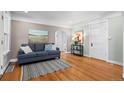 Bright living room with hardwood floors, stylish decor, and ample natural light at 5008 Sherman St, Denver, CO 80216
