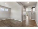 Spacious living room with wood floors and ample natural light at 2248 Rosette Ln, Castle Rock, CO 80104