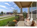 Covered porch with seating area, overlooking the street at 2388 W 165Th Pl, Broomfield, CO 80023