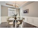 Elegant dining room featuring a modern chandelier and stylish decor at 4406 Sidewinder Loop, Castle Rock, CO 80108