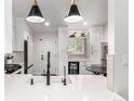 Bright and modern kitchen featuring white countertops, stainless steel appliances, and stylish fixtures at 12908 Hudson St, Thornton, CO 80241