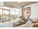 Cozy living room with a balcony showing skyline views at 1700 Bassett St # 2216, Denver, CO 80202