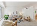 Bright and airy living room with neutral tones, vaulted ceiling and comfortable seating arrangement at 17611 Hoyt Pl, Parker, CO 80134