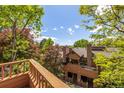 Exterior view of multiple decks surrounded by lush trees providing homeowners with an outdoor space at 9400 E Iliff Ave # 88, Denver, CO 80231