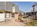 A brick townhouse with a well-maintained yard and covered entryway at 5809 S Pearl St, Centennial, CO 80121