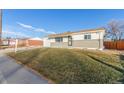 Charming single-story home with a well-maintained lawn and a freshly painted exterior at 9120 Judson St, Westminster, CO 80031