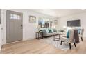 Bright living room with neutral decor, modern furnishings, and large windows that flood the space with natural light at 9120 Judson St, Westminster, CO 80031