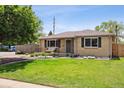Well-maintained ranch home featuring a green lawn, attractive landscaping, and welcoming entrance at 4780 E Montana Pl, Denver, CO 80222