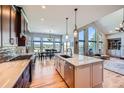Spacious kitchen with a center island, stainless steel appliances, and scenic views at 4781 Mariposa Rd, Castle Rock, CO 80104