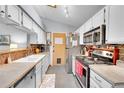 Functional kitchen showcasing stainless steel appliances, ample counter space, and a traditional design at 5323 E Sandpiper Ave, Castle Rock, CO 80104