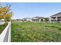 Large lot with a white fence surrounding the property in a quiet neighborhood at 5670 Pinto Valley St, Parker, CO 80134