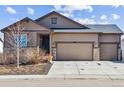 Charming single-Gathering home with three-car garage, neutral paint, stone accents, and well-maintained yard at 5670 Pinto Valley St, Parker, CO 80134