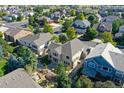 Beautiful home with backyard patio and fence surrounded by mature trees in a Gathering-friendly neighborhood at 11973 Song Bird Hills St, Parker, CO 80138