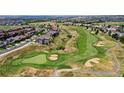 Beautiful aerial view of the community golf course and surrounding neighborhood at 11973 Song Bird Hills St, Parker, CO 80138