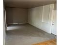 Spacious living room with neutral carpet, offering a blank canvas ready for personalization and comfortable living at 6085 Simms St, Arvada, CO 80004