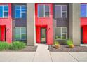 Exterior of modern townhome featuring red accents, and tidy landscaping at 3044 Wilson Ct # 2, Denver, CO 80205