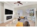 Bright living room with fireplace, large windows, and neutral decor at 3044 Wilson Ct # 2, Denver, CO 80205