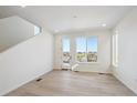 Bright living space features a door to a balcony with great neighborhood views at 1243 Rhett Dr, Erie, CO 80026
