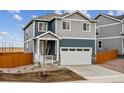 Inviting two-story home with a two-car garage, nice landscaping, and pleasant curb appeal at 17817 Dandy Brush Dr, Parker, CO 80134